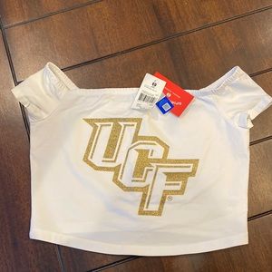Off the shoulder white UCF crop top. UCF is in gold glitter.